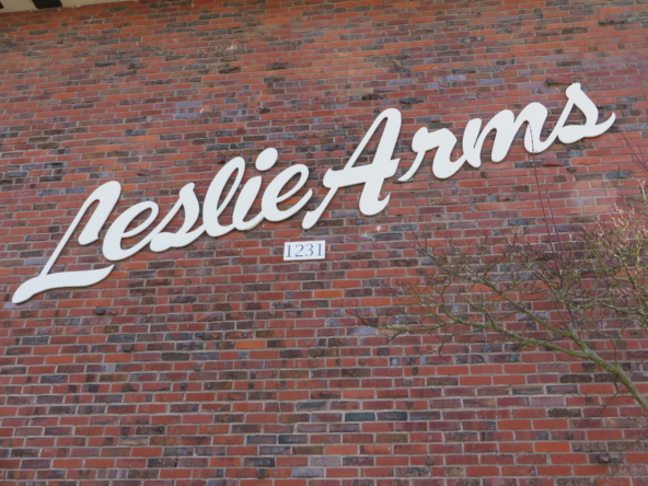 Leslie Arms apartments sign on building